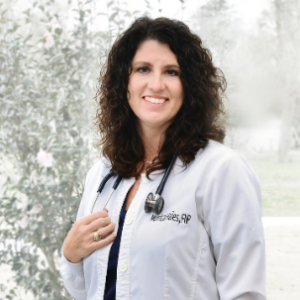 dark haired woman smiling at the camera